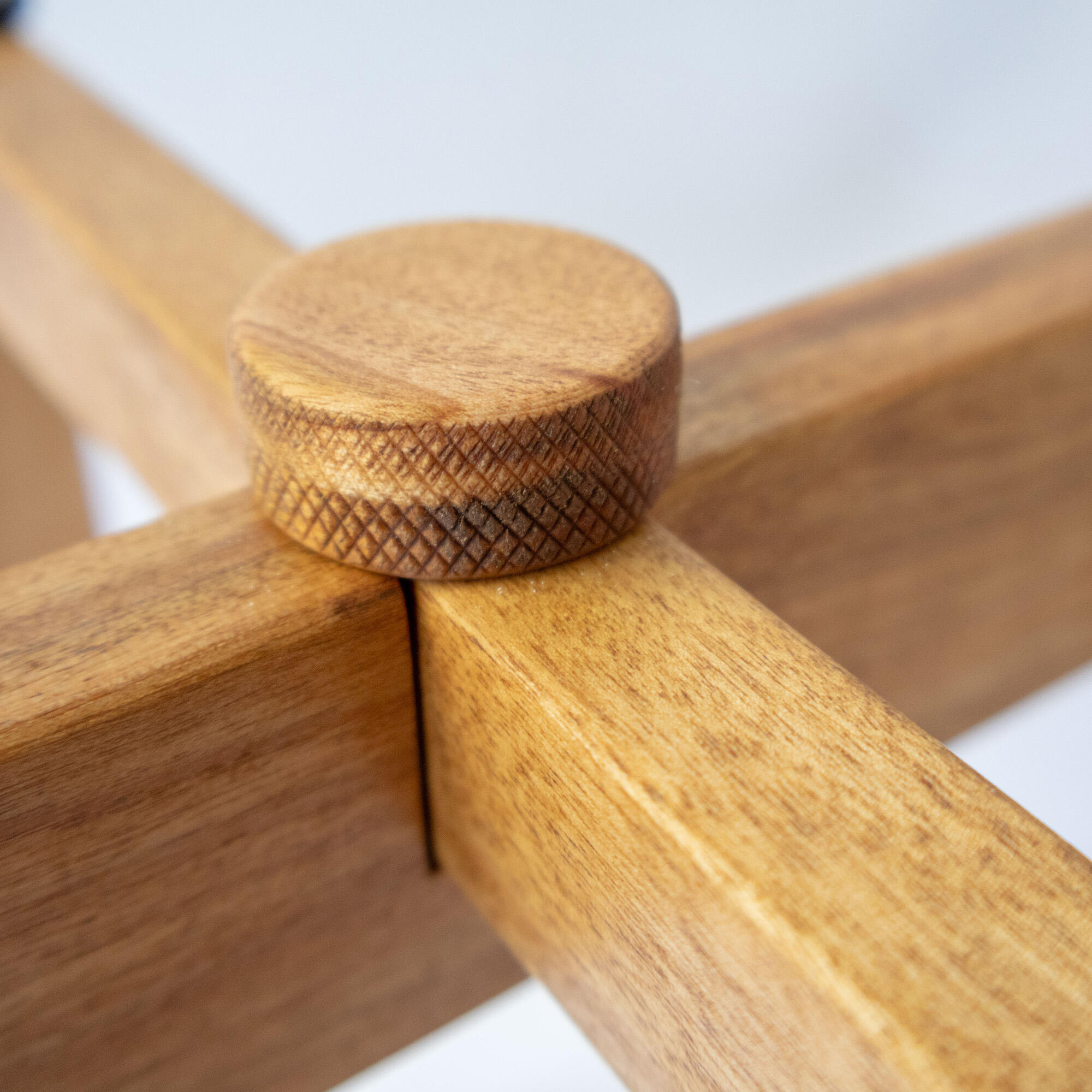 Closeup of a wood furniture piece on a white background