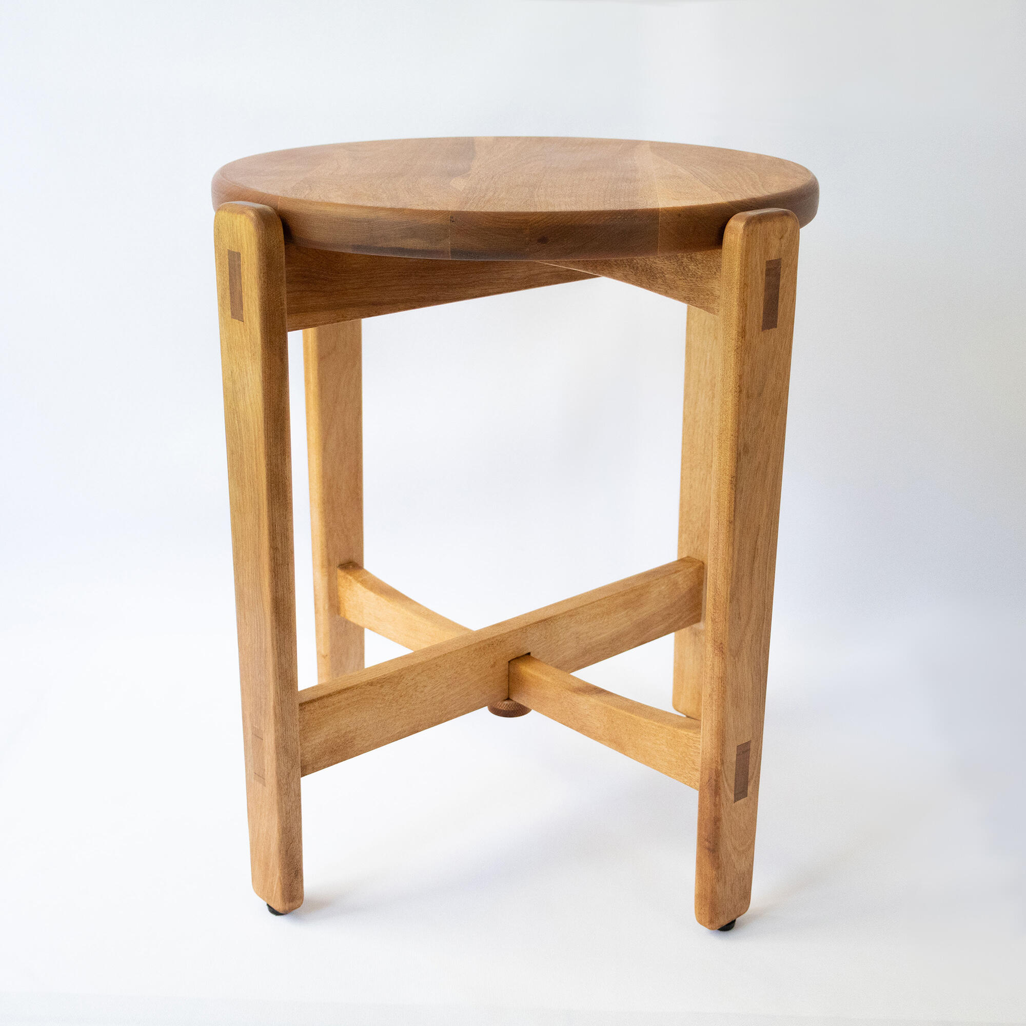 birch wood table with round top and 4 legs on white background