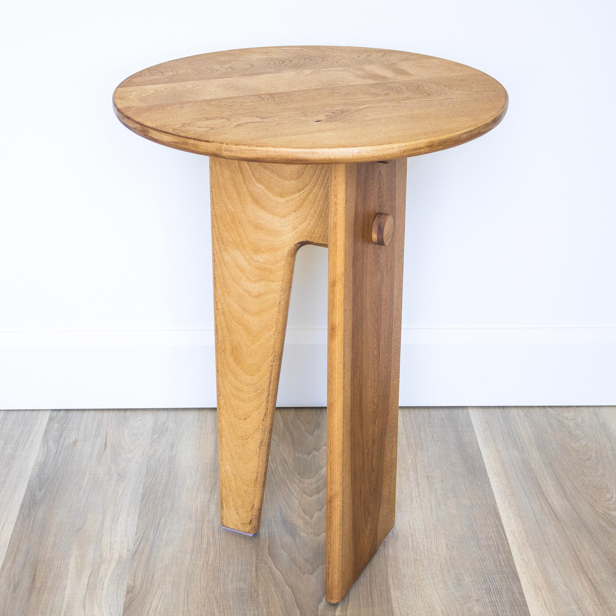 birch wood table with round top and 4 legs on white background