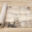 Aurora Distressed Rug - Cream Brown roll on floor