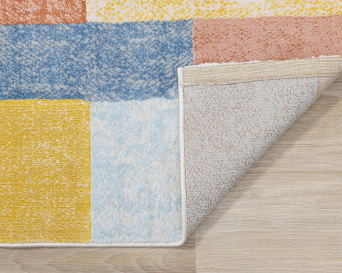 Belle Plush Rug - Geometric Blocks corner flipped to show underside