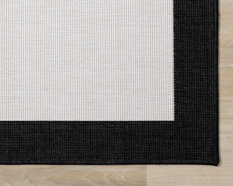 Bristol Reversible Indoor / Outdoor Rug - Cream with Black Border corner detail
