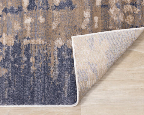 Chorus Plush Rug - Abstract Earth Blue / Beige corner flipped to show underside of rug
