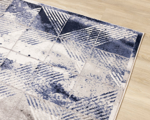 Chorus Distressed Rug - Blue & Grey Triangles croner detail