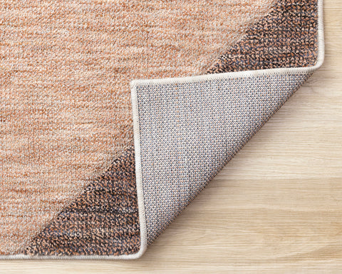 Cora Rug - Geometric Pink Taupe corner flipped to show underside