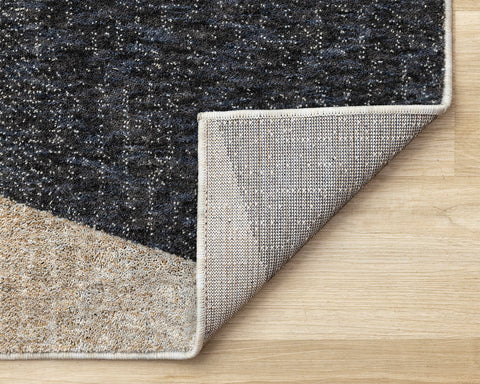 Cora Rug - Geometric Black Brown corner flipped to show underside