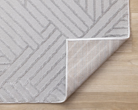 Ellington Rug - Grey Abstract Herringbone corner flipped to show underside