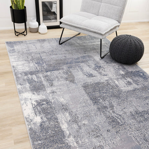 Emory Distressed Rug - Grey in living room setting