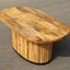 Solid mango wood oblong coffee table with repeating pattern ribbing base in natural finish.