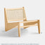 Lounge chair in natural stained ash wood frame with natural rattan seat and back.
