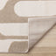 Leo Rug - Beige Mid-Century Modern corner flipped to show underside