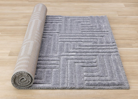 Luxe Rug - Blue Maze roll on floor