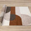 Malibu Rug - Curvy Geometric Taupe Oxblood roll on floor