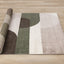 Malibu Rug - Curvy Geometric Taupe Green roll on floor