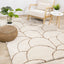  Maroq Shag Rug - Orange / Cream Round Hills in living room setting