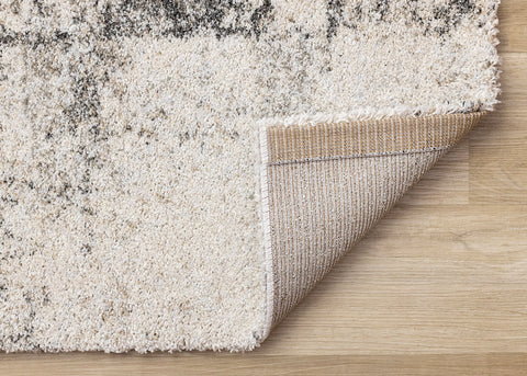 Marquis Distressed Rug - White Grey Patches corner flipped to show underside