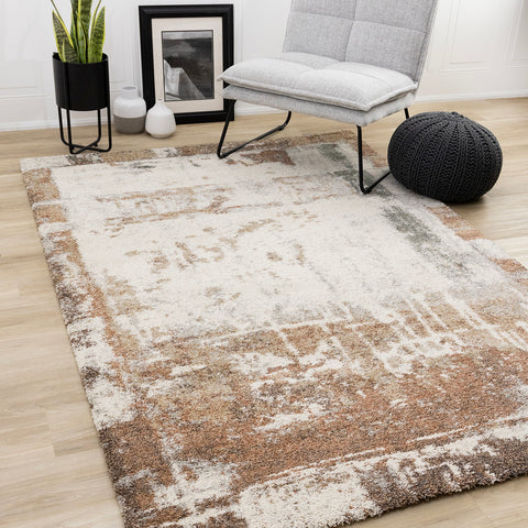 Marquis Distressed Rug - Orange Cream in living room setting