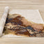 Muse Plush Rug - Marble Grain roll on floor