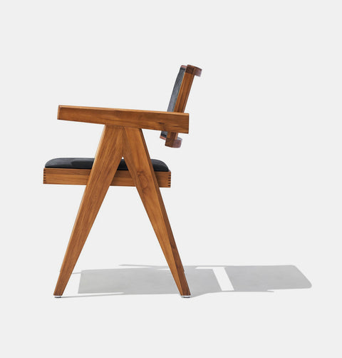 Solid ash wood dining chair stained in walnut with genuine black leather seat and back. 