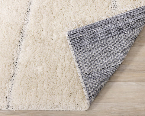 Novato Rug - Asymetric Lines Cream corner flipped to show underside