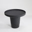 Minimal black powder coated aluminum side table resembling a pier bollard with a black marble base.