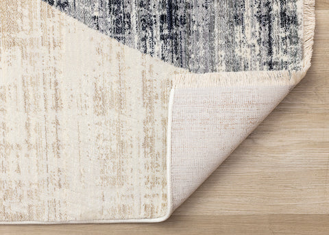 Serene Distressed Rug - Curvy Shapes corner flipped to show underside
