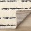 Talia Rug - Black Rain corner flipped to show underside