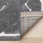 Talia Rug - Black Broken Lattice corner flipped to show underside