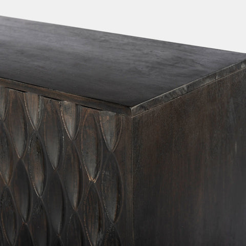 Solid mango wood sideboard in grey finish with golden iron legs in mid-century style. CNC carved detailed doors. Corner detail.