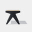 Solid black stained ash wood bench with solid frame and woven natural rattan seat. Side detail.