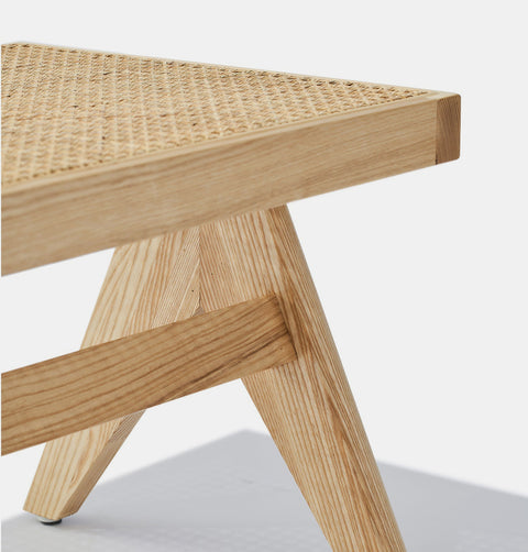 Solid natural ash wood bench with solid frame and woven natural rattan seat.