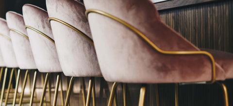 Series of Scandinavian velvet barstools in perspective from bottom.