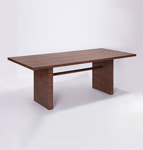 Walnut dining table, with solid wood ribbed base, and walnut veneer top.